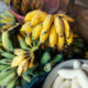 Banana in the hand of the seller for processing |https://fruitsauction.com/